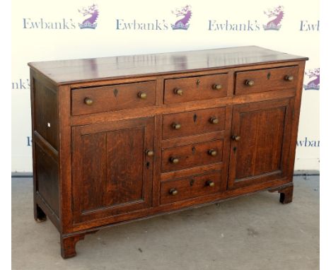 19th century oak sideboard dresser base with 3 short drawers above a row of 2 short drawers, and one faux drawer between two 