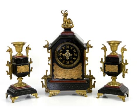 Late 19th century French Aesthetic movement Japonisme black slate and gilt metal mounted clock garniture, the central clock w