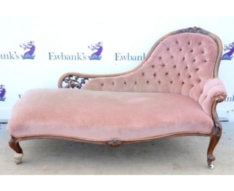 Late 19th Century walnut button back chaise lounge upholstered in pink velour fabric with carved show frame on cabriole legs.