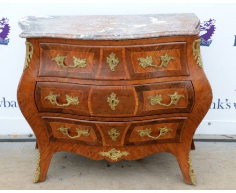 19th century Swedish kingwood and gilt metal mounted bombe commode, the serpentine marble top above three graduating drawers 