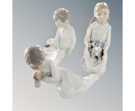 Three Nao figures : children in night dress 