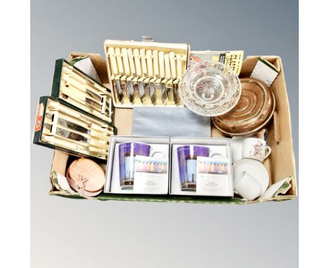 A box of Royal Worcester boxed mugs, vintage cutlery, pieces of crystal ware, antique copper bed warmer etc 