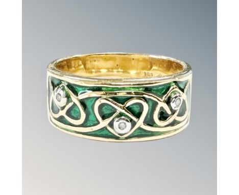 A silver gilt and enamel ring 