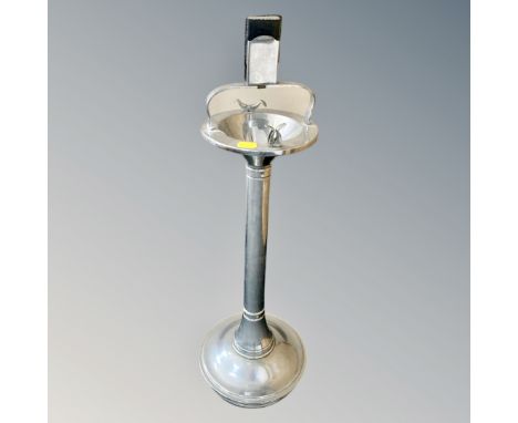A chrome smoker's stand together with a pocket lighter 