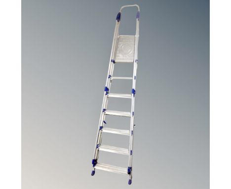 An Abru 8-tread folding aluminium ladder with hand rails 