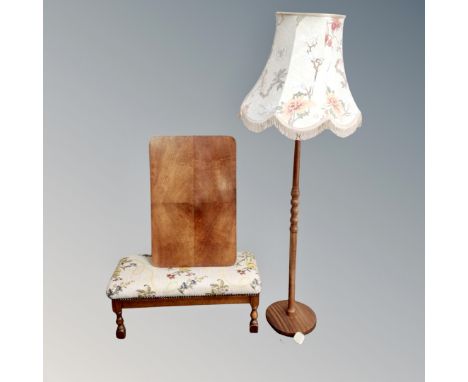 A floral fabric upholstered footstool, folding occasional table and a beechwood standard lamp 