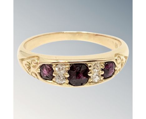 A gold diamond and ruby ring, size N CONDITION REPORT: Marks rubbed. 4g. 