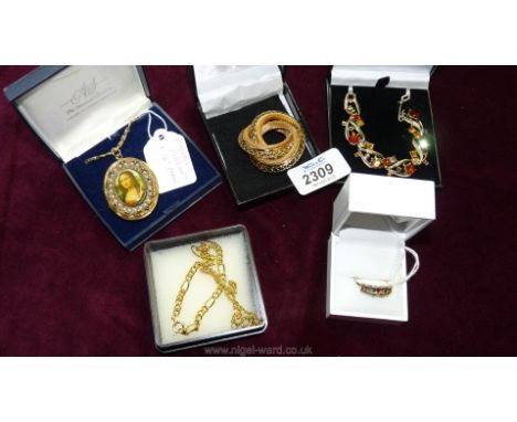 A box containing two small gold coloured bracelets, a seven stone gold metal ring, a 16" Madonna pendant and chain, a gold co