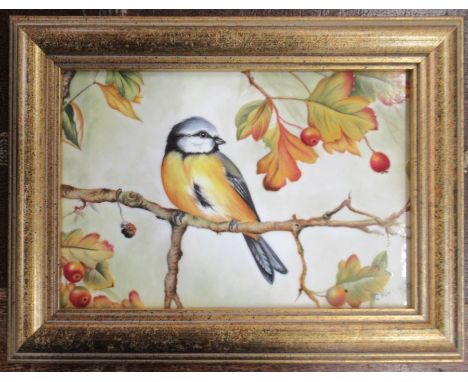 A framed Royal Worcester rectangular porcelain plaque, decorated with a bird in foliage by Winwood, 4.5ins x 6.75ins