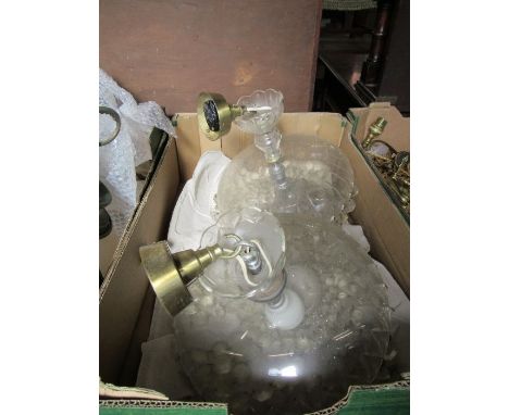 A pair of glass light fittings