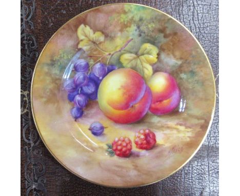 A Royal Worcester plate, decorated with fruit to a mossy background by H Price, diameter 4.25ins
