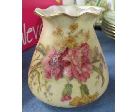 A Royal Worcester blush ivory vase, decorated with flowers, shape number G957