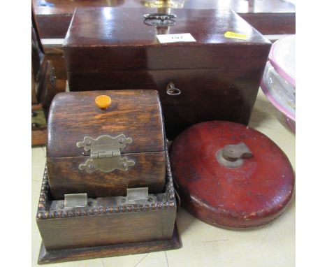 An Antique mahogany box, together with an oak box and a Vintage tape measure