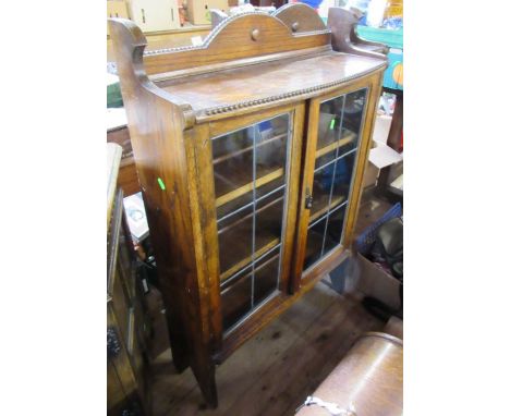 An oak glazed cabinet, together with similar bookcase, width 29ins, height 44ins