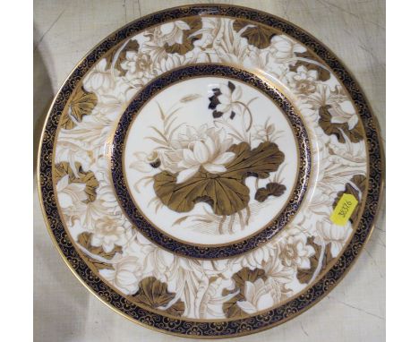 A Royal Worcester plate, decorated with a lily and pad, diameter 10.5ins