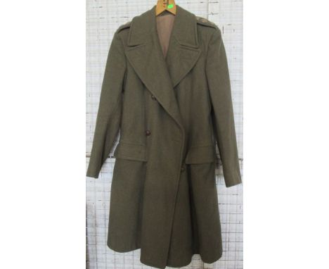 A Unikit green army issue wool great coat, with embroidered military badges to the epilates&nbsp;