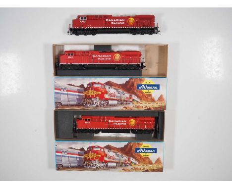 A group of Canadian outline HO gauge diesel locomotives by ATHEARN comprising 2x powered and 1x dummy AC4400s in Canadian Pac