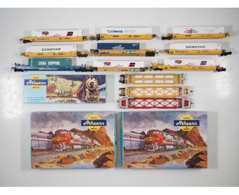 A group of boxed and unboxed American outline HO gauge Husky Stack wagons by ATHEARN and others comprising multi units and si