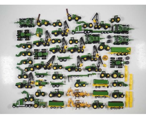 A large quantity of 1:87 HO scale diecast tractors and other farming equipment by various manufacturers, all in John Deere br