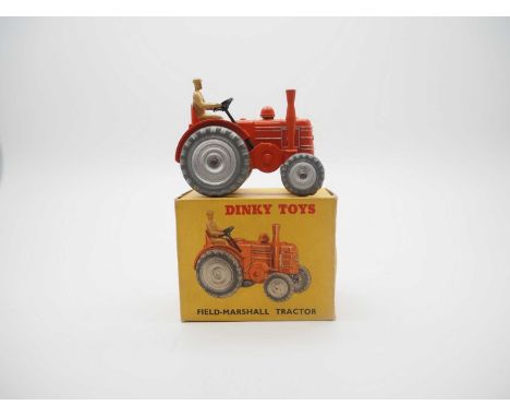 A DINKY Field Marshall Tractor in dual numbered box 301 (27n) - orange, silver metal wheels and trim, light tan figure driver