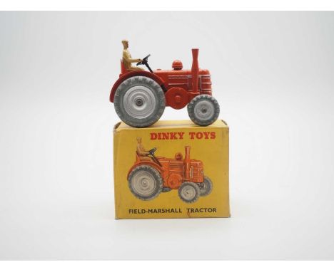 A DINKY Field Marshall Tractor in dual numbered box 301 (27n) - orange, silver metal wheels and trim, light tan figure driver