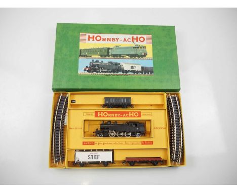 A HORNBY ACHO HO gauge French outline  steam good trains set comprising steam tank loco, 3 wagons and track in earlier green 