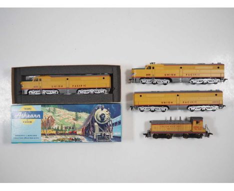 A group of boxed and unboxed American outline HO gauge diesel locomotives by ATHEARN comprising a PA1-PB1-PA1 combination and