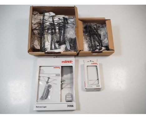 A small group of MARKLIN HO gauge catenary packs (contents unchecked) together with a larger group of good quality cast metal