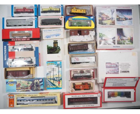 A large group of HO gauge wagons, coaches (including kits), building kits, accessories and an ATHEARN 3154 Union Pacific Loco