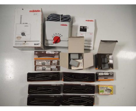 A group of MARKLIN Z gauge boxed track and accessories together with a boxed 6647 AC transformer/controller
