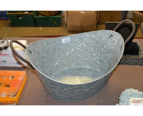 A small galvanised oval planter (23)