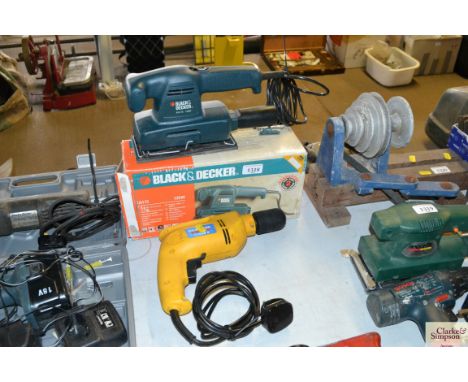 A Black &amp; Decker orbital sander and a Classic Power electric drill