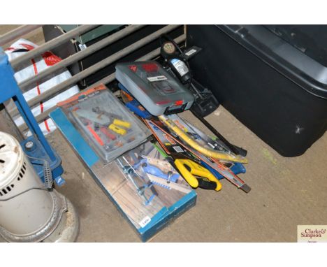 A quantity of tools including mitre saw, bow saw, foot pump etc.