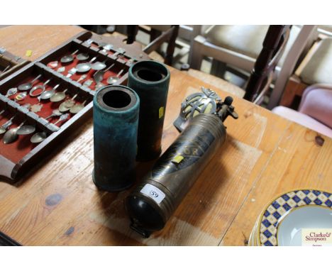 A vintage Valor fire extinguisher, an AA Badge and two possible engine starters for a Vulcan bomber