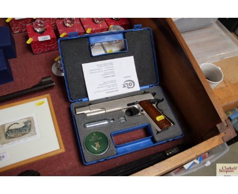 A CO2 powered 177 Colt 1911 A1 pistol in fitted case with two magazines, spare cartridge, pellets and instruction manual