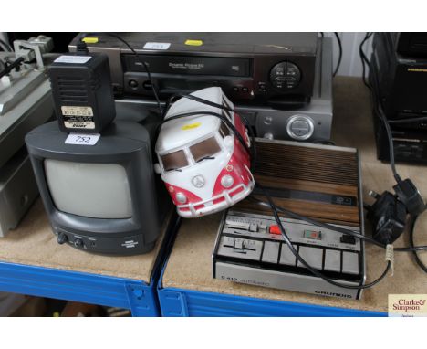 A portable TV together with a lamp in the form of a VW campervan  and a Grundig microphone