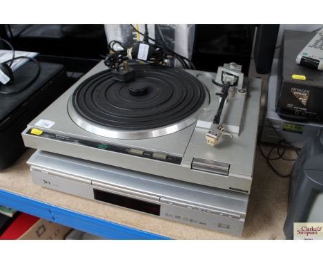 An Hitachi turntable together with an LG DVD player