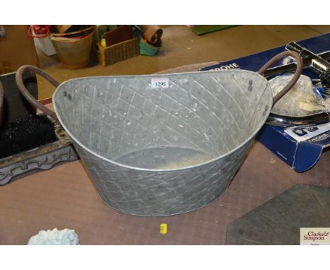 A small oval galvanised planter (22)