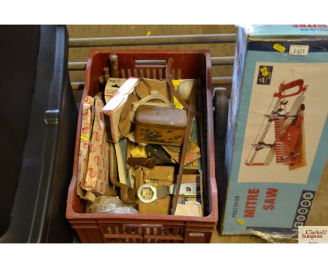 A box containing various tools, a large quantity of screws, etc.