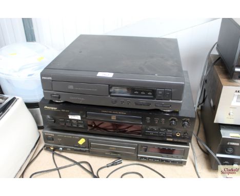 A Philips CD player together with a Pioneer Compact Disc recorder and a Techniques Compact Disc player