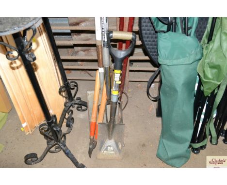 A quantity of long handled gardening tools 