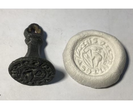 Medieval “chess piece” circular style bronze seal matrix, hexagonally facetted trefoil terminal. Design is of an Hare facing 