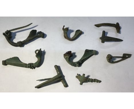 A mixed lot of nine copper alloy Roman brooches. Various forms including Headstud, Colchester Derivative, Trumpet, Hod Hill. 