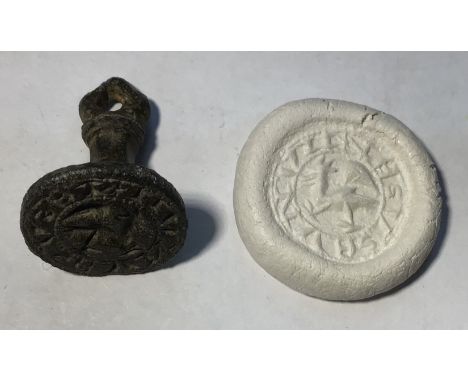 Medieval “chess piece” circular style bronze seal matrix, hexagonally facetted handle with pointed pierced trefoil terminal.S