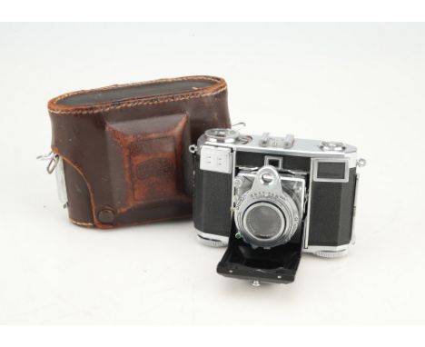 A Zeiss Ikon Contessa 533/24 35mm Rangefinder Camera,chrome, body VG-E, shutter working, rangefinder patch clear and travels,