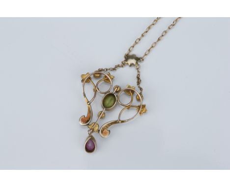 An Edwardian Art Nouveau Precious Stone Pendant,set with seed pearls, peridot and amethyst, on fine link chain 3.2 g Broken l