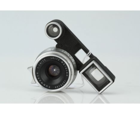 A Leitz Summaron f/2.8 35mm Lens,chrome, with ocular attachment, serial no. 1677106, body, G, elements, F-G, some blooming sp