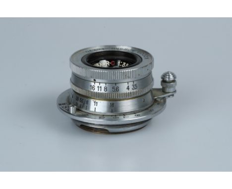 A Nikon Nippon-Kogaku W- Nikkor.C f/3.5 35mm Lens,LTM, chrome, serial no. 427128, body, G, elements, VG, some light internal 