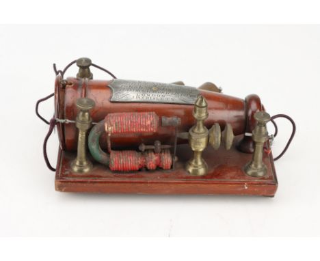 Grigg's Conical Electro Magnetic Machine,English, c.1875, the conical coil in turned mahogany case with turned mahogany end c