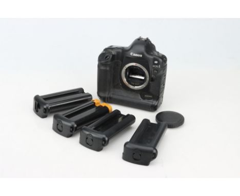 A Canon EOS-1 Ds Digital Camera Body,with four additional battery packs, untested
